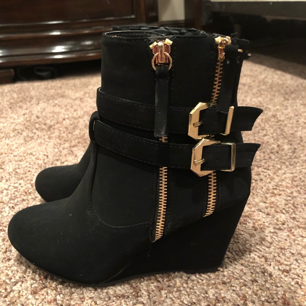 Black booties with gold buckles